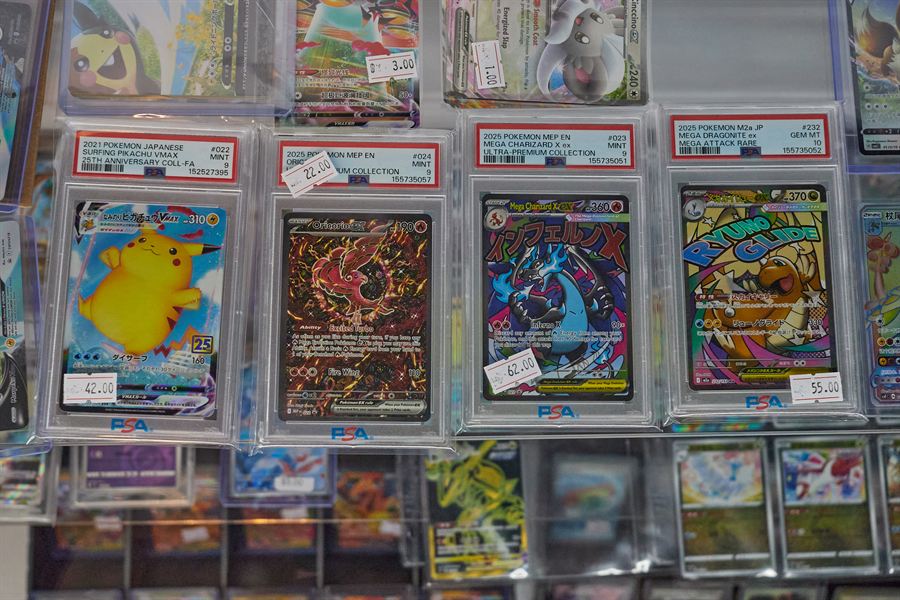 PSA-graded Pokémon cards in the display case