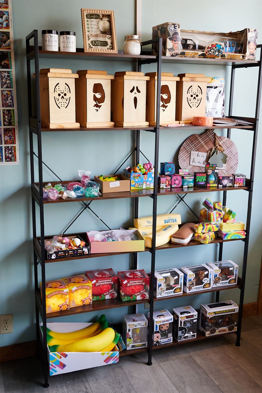 A tall shelf of gifts, plush, and boxed collectibles